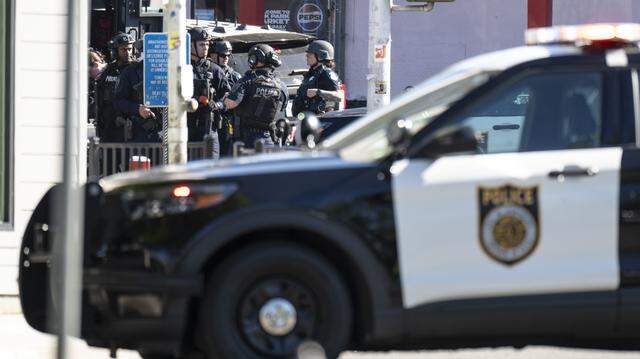 Sacramento Police officers respond to a standoff incident at the Oak Park Market in south Oak Park on Thursday, March 12, 2026.
